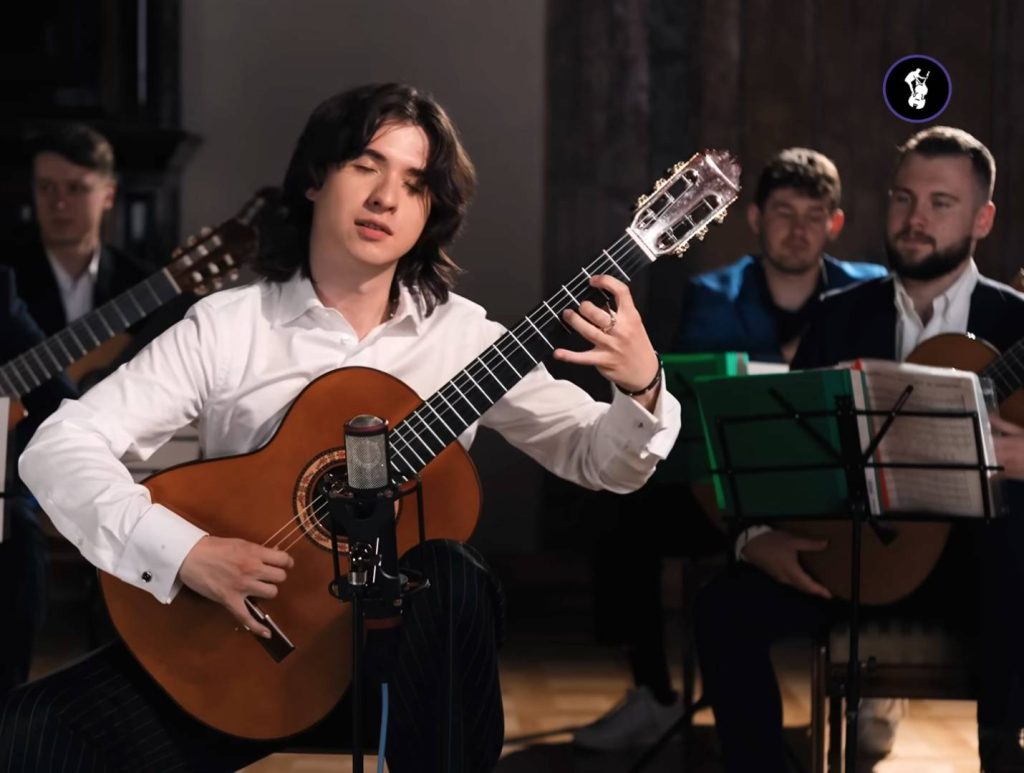 Virtuoso Guitarist Marcin Returns To Music Class After Ten Years And Recreates The Moment He First Passed His Exam With All His Old Classmates Watching